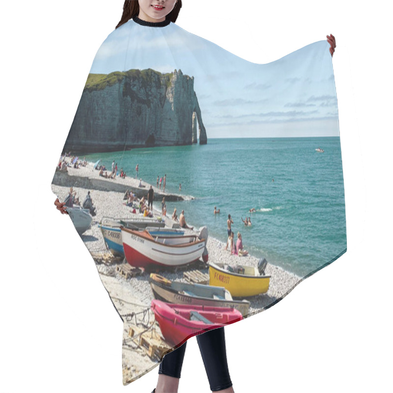 Personality  A Serene View Of The Iconic Etretat Beach In Normandy, France, Featuring The Breathtaking Chalk Cliffs With Their Famous Natural Arch In The Background. In The Foreground, Small Colorful Boats Rest On The Shore While A Few People Relax, Enjoying The  Hair Cutting Cape