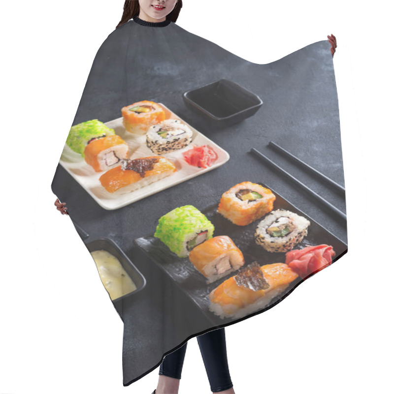 Personality  Traditional Japanese Food- Sushi, Rolls, Chopsticks, Soy Sauce On Black Slate Background. Sushi Menu. Top View Copy Space Hair Cutting Cape