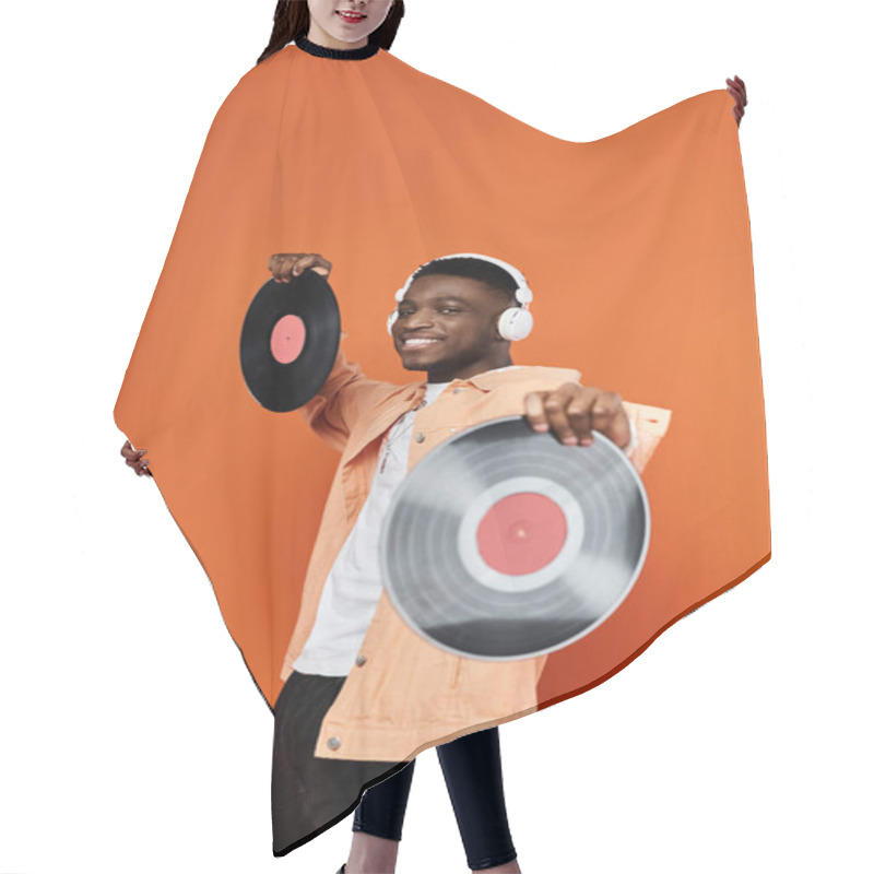 Personality  Stylish Young African American Man Holding Vinyl Record On Orange Background. Hair Cutting Cape