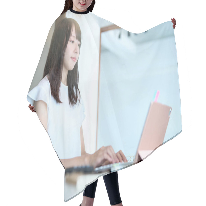 Personality  Asian Young Woman Operating A Tablet PC In The Room Hair Cutting Cape