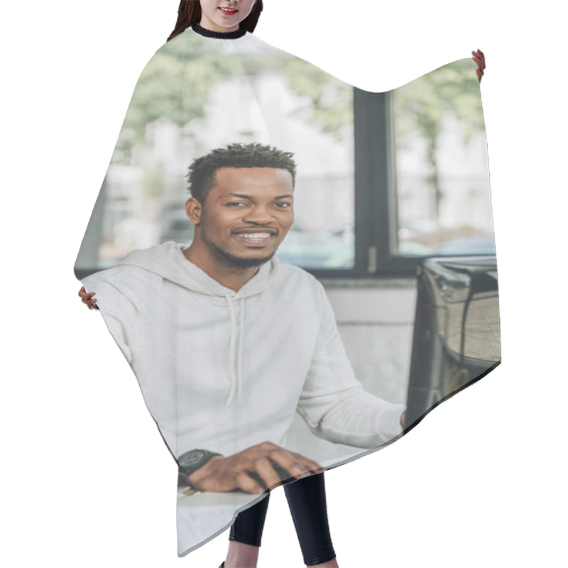 Personality  Happy African American Programmer Looking At Camera While Sitting At Workplace In Office Hair Cutting Cape