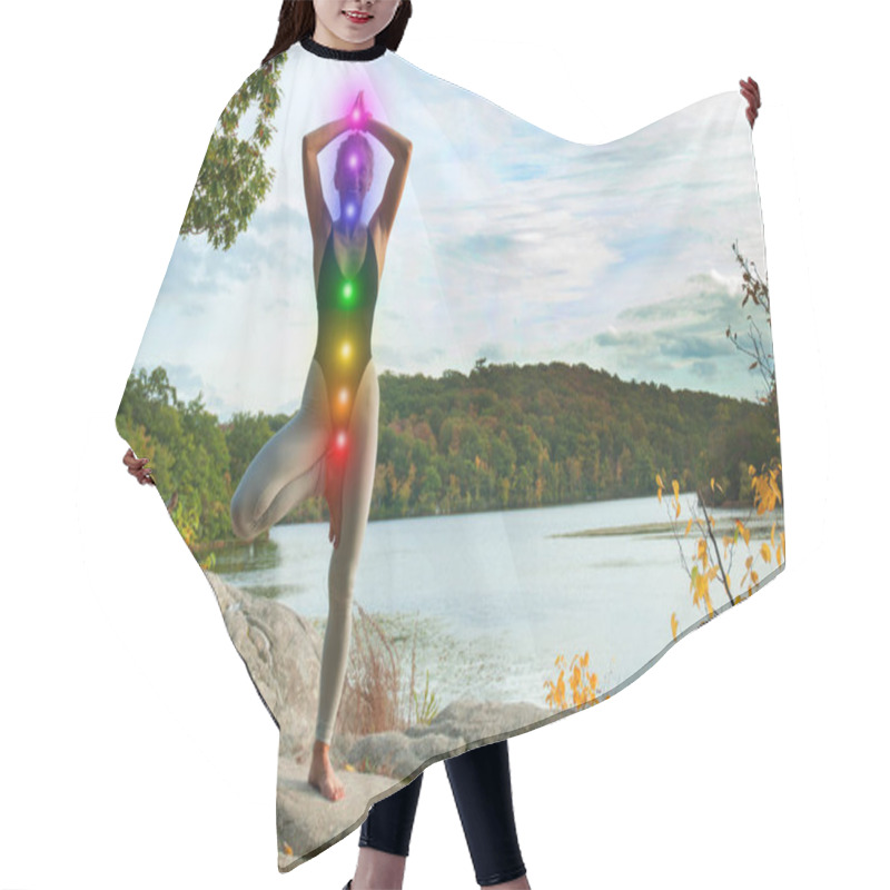 Personality  Woman Is Meditating With Glowing Seven Chakras.  Beautiful  Woman Is Practicing Yoga On The Lake. Hair Cutting Cape