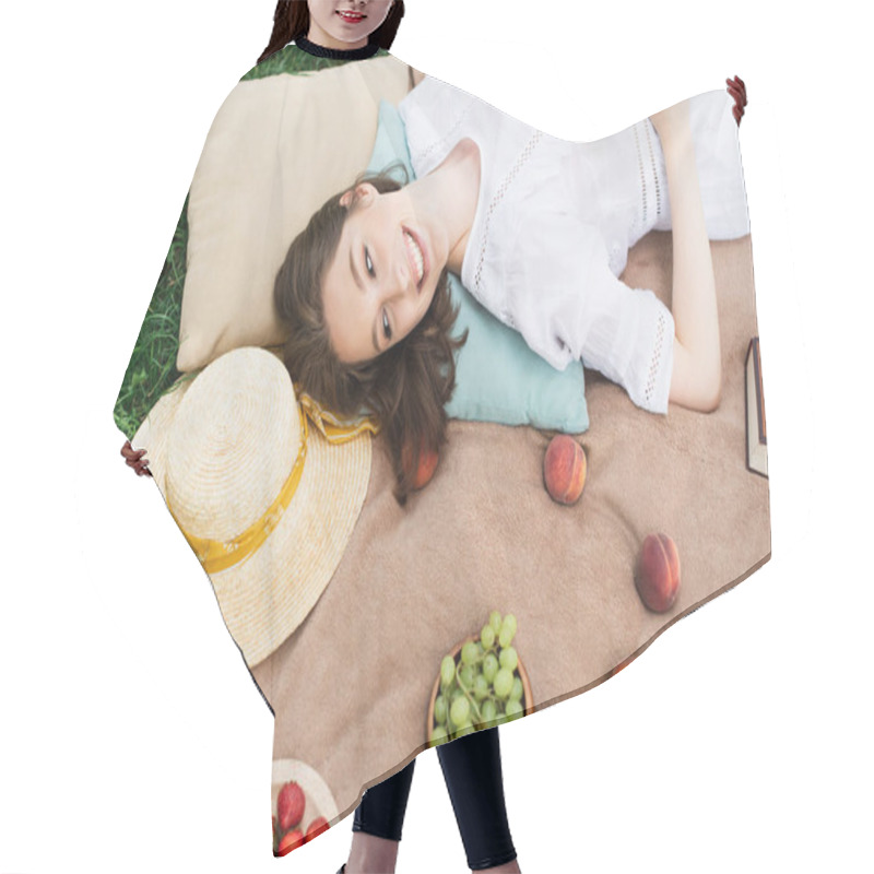 Personality  Top View Of Positive Woman Looking At Fresh Fruits Near Straw Hat On Picnic Blanket  Hair Cutting Cape