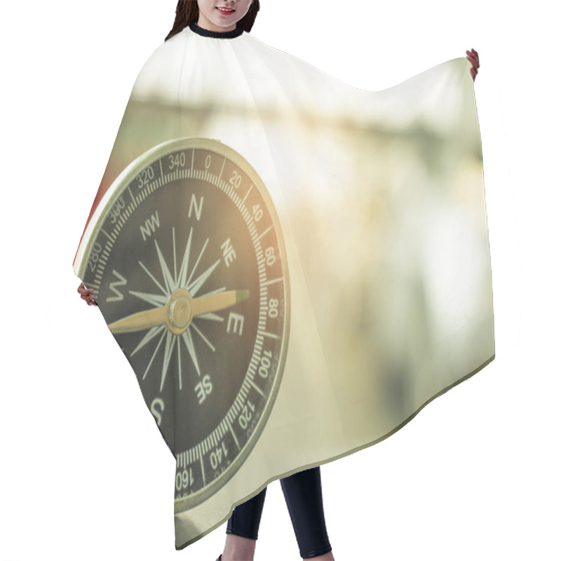 Personality  Holding Compass On Tree Mountain And Sea Blurry Background. Using Wallpaper Or Background Travel Or Navigator Image. Hair Cutting Cape