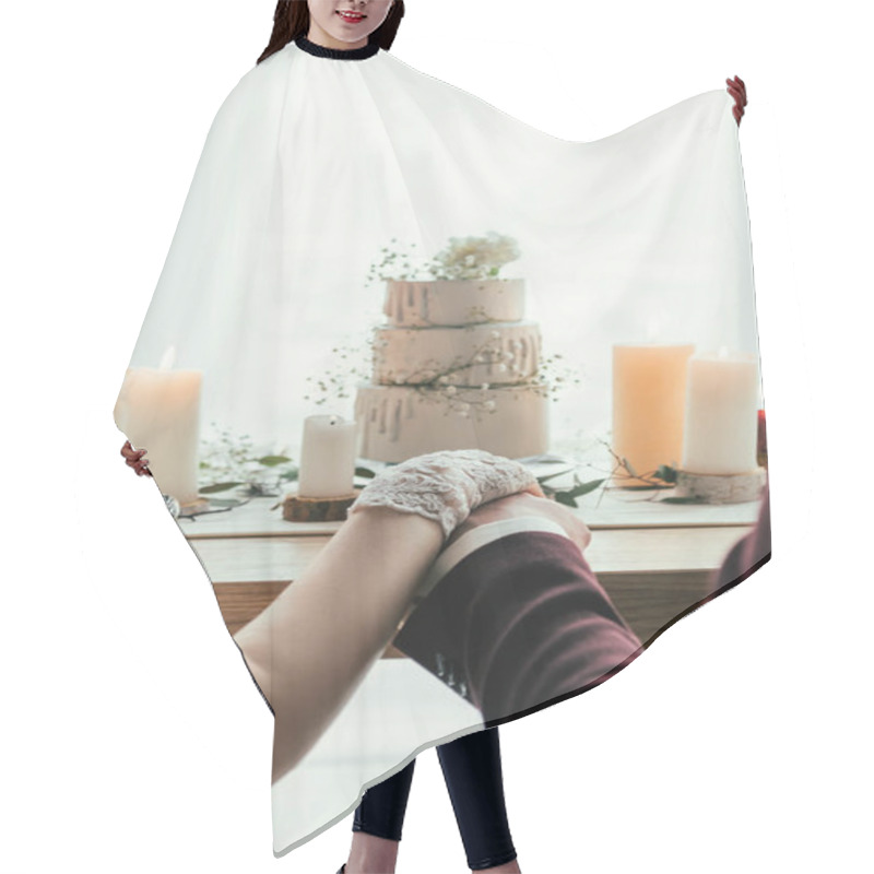 Personality  Partial View Of Newlyweds Holding Hands While Sitting At Served Table With Wedding Cake, Rustic Wedding Concept Hair Cutting Cape