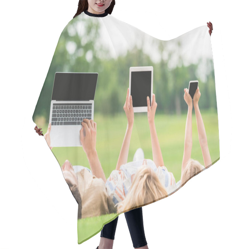 Personality  Family Lying On Grass And Using Digital Devices With Blank Screens Hair Cutting Cape