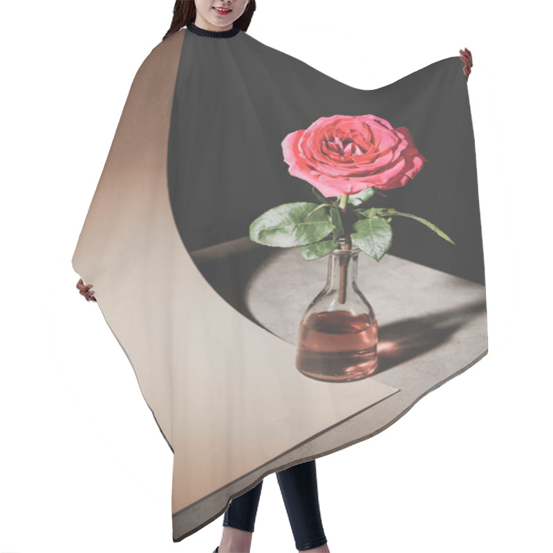 Personality  Pink Rose Flower In Glass Bottle On Stone Table With Sheet Of Paper Isolated On Black Hair Cutting Cape