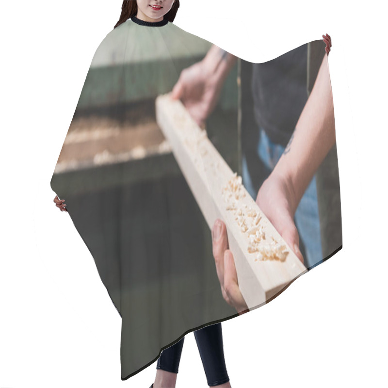 Personality  Cropped View Of Woodworker Holding Board Near Blurred Thickness Planner  Hair Cutting Cape