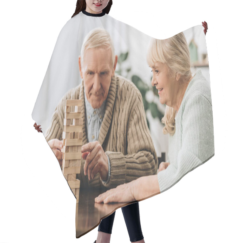 Personality  Retired Husband And Wife Playing Jenga Game On Table Hair Cutting Cape