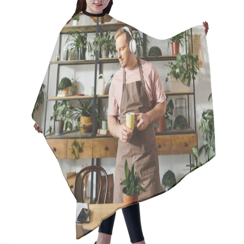 Personality  A Man In An Apron Enjoying A Cup Of Coffee In A Plant Shop, Showcasing The Concept Of Owning A Small Business. Hair Cutting Cape