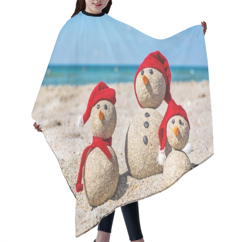 Personality  Sandy Snowmen. Holiday Concept  Hair Cutting Cape