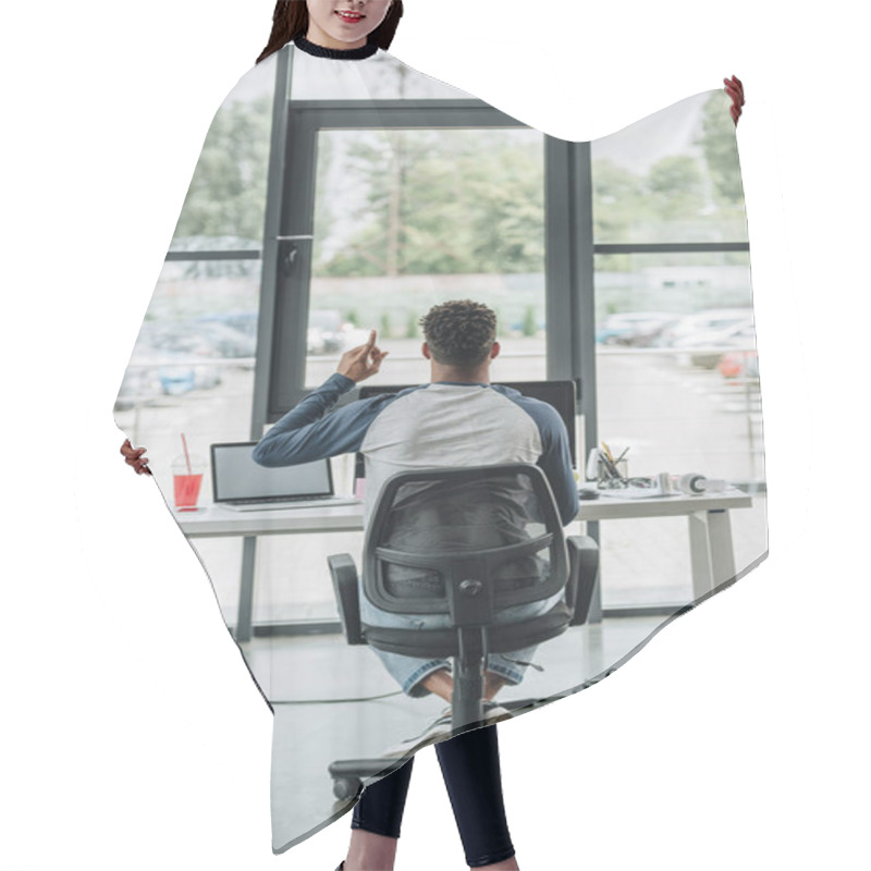 Personality  Back View Of Young African American Programmer Showing Idea Sign While Sitting At Workplace In Office Hair Cutting Cape