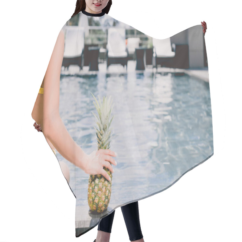 Personality  Cropped View Of Woman In Swimsuit Sitting Near Swimming Pool And Holding Ripe Pineapple Hair Cutting Cape