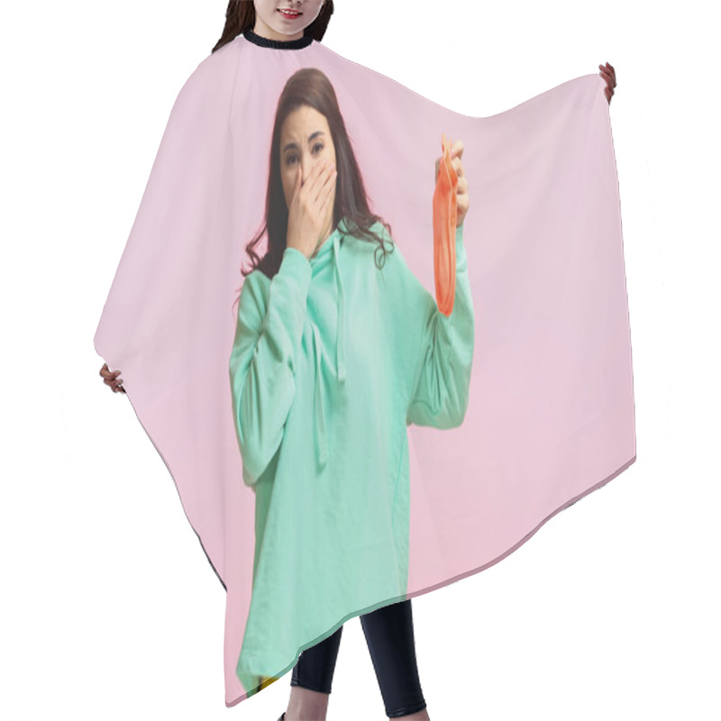 Personality  Young And Brunette Woman In Turquoise Hoodie Plugging Nose While Holding Stinky Socks Isolated On Pink  Hair Cutting Cape