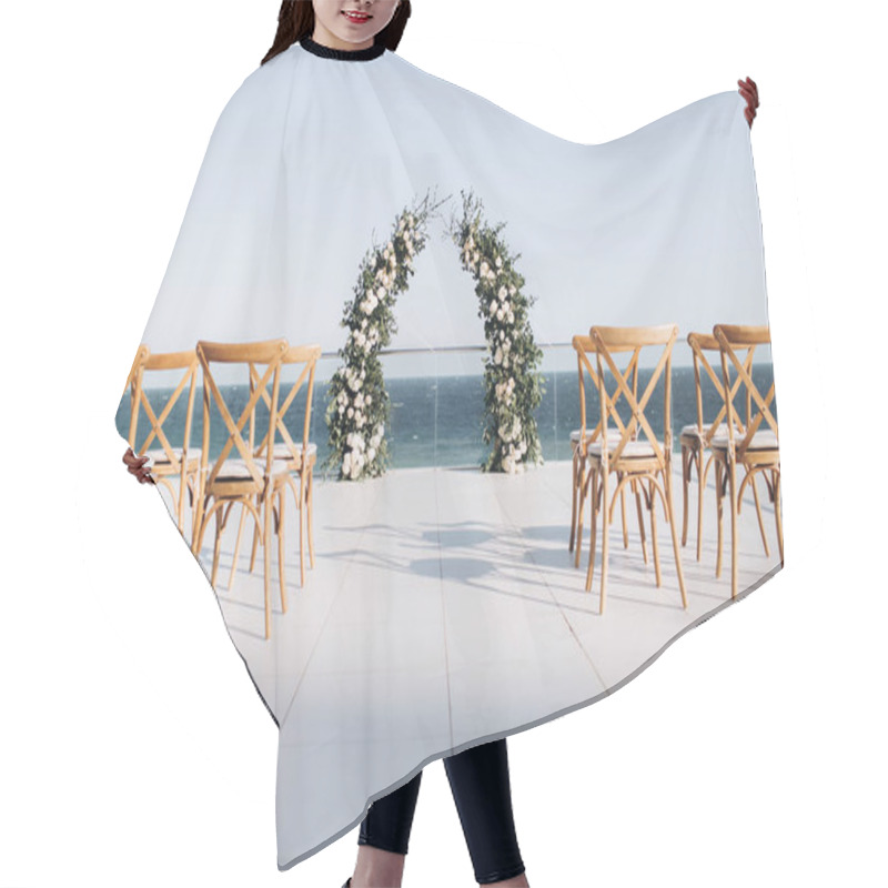 Personality  Arch Decorated With Lively Floristics On The Background Of The Sea. Hair Cutting Cape