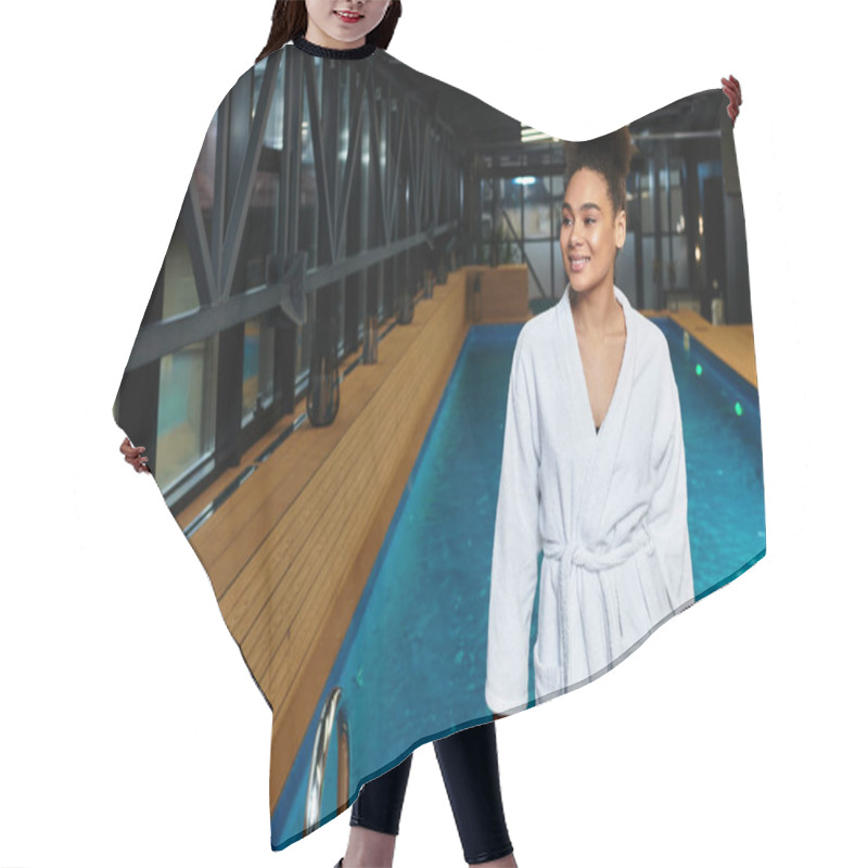 Personality  A Young Chic Woman Strolls By A Tranquil Indoor Spa Pool, Embracing Relaxation. Hair Cutting Cape