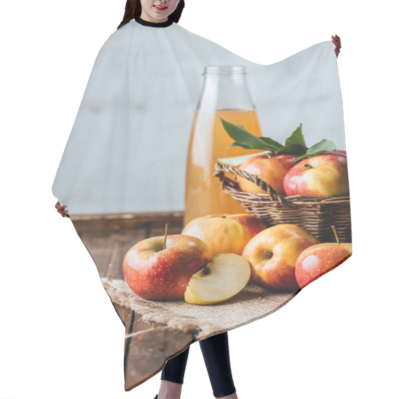 Personality  Close Up View Of Glass Bottle Of Apple Juice And Apples In Basket On Wooden Tabletop Hair Cutting Cape