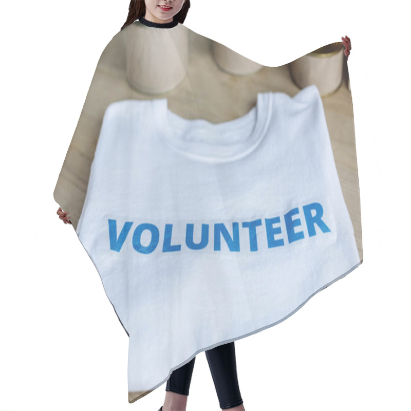 Personality  Selective Focus Of White T-shirt With Blue Volunteer Inscription On Wooden Table Hair Cutting Cape