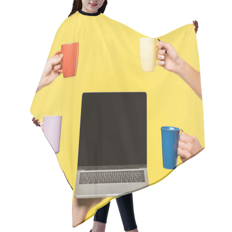 Personality  Cropped Shot Of Hands Holding Cups And Laptop With Blank Screen Isolated On Yellow  Hair Cutting Cape