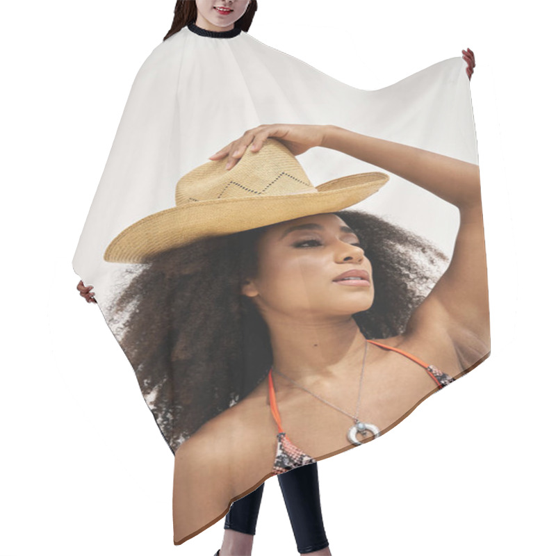 Personality  A Confident Young Woman Elegantly Poses, Wearing A Trendy Swimsuit And A Chic Straw Hat. Hair Cutting Cape