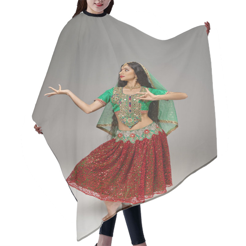 Personality  Vertical Shot Of Indian Attractive Woman In Traditional Clothes Gesturing While Dancing Actively Hair Cutting Cape