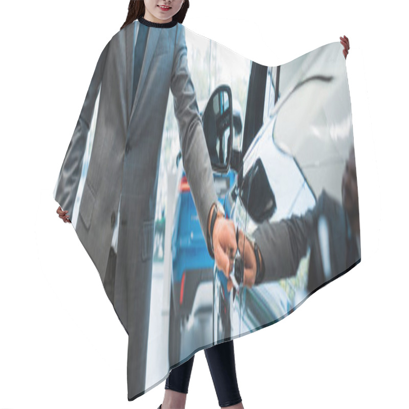 Personality  Panoramic Shot Of Man Opening Car Door In Car Showroom  Hair Cutting Cape