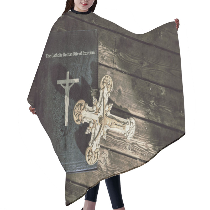 Personality  3d Illustration Of The Exorcism Book On Wooden Floor  Hair Cutting Cape