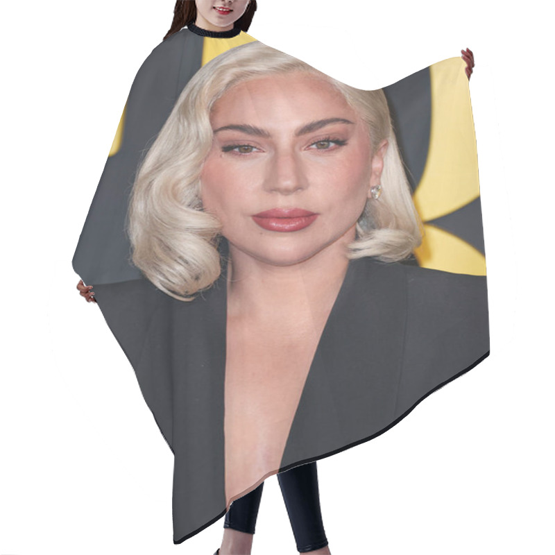 Personality  Lady Gaga (Stefani Joanne Angelina Germanotta) Wearing An Alexander McQueen Suit Arrives At The Los Angeles Special Screening Of Netflix's 'Maestro' Held At The Academy Museum Of Motion Pictures On December 12, 2023 In Los Angeles Hair Cutting Cape