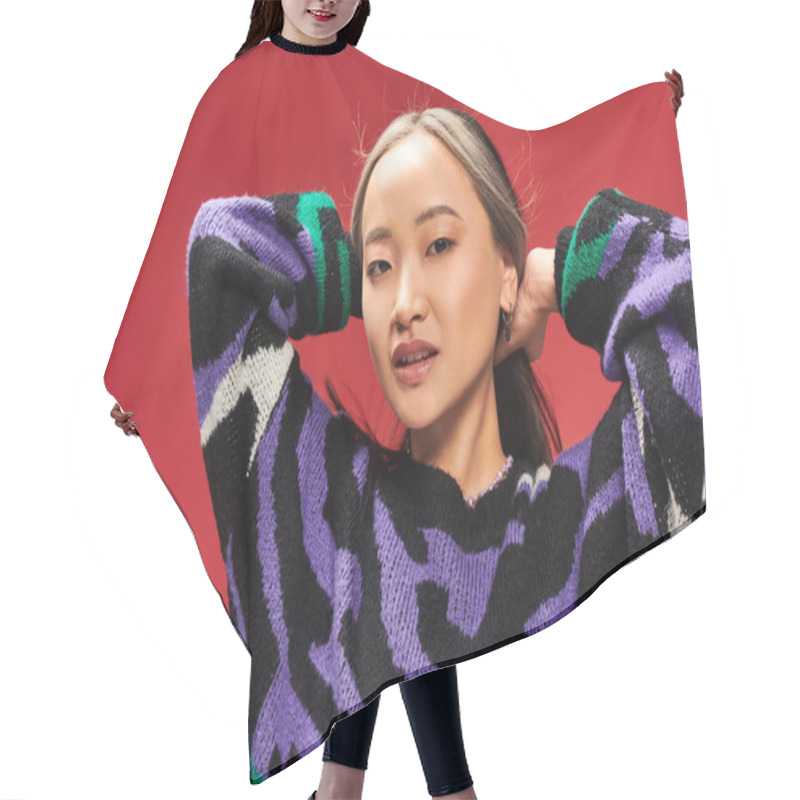 Personality  Pretty And Young Asian Woman With Dyed Hair In Vibrant Sweater With Animal Print Posing On Red Hair Cutting Cape