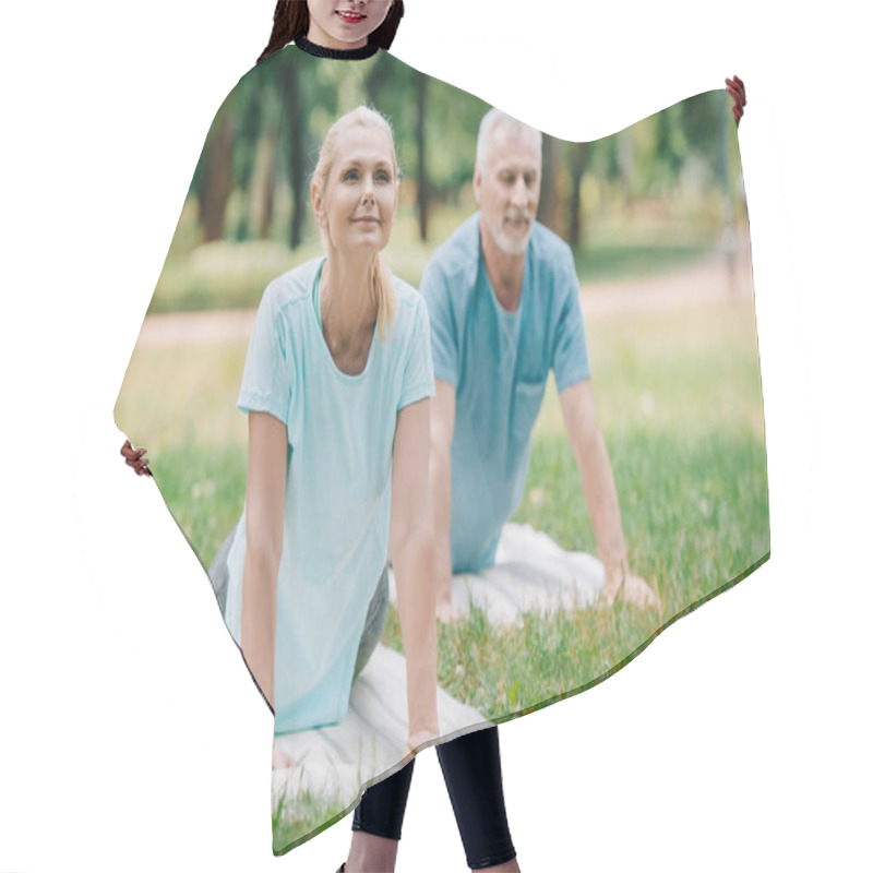 Personality  Smiling Man And Woman Practicing Relaxation Yoga Poses On Yoga Mats Hair Cutting Cape