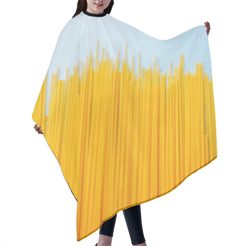 Personality  Wheat Pasta Spaghetti Isolated On A Blue Background. Hair Cutting Cape