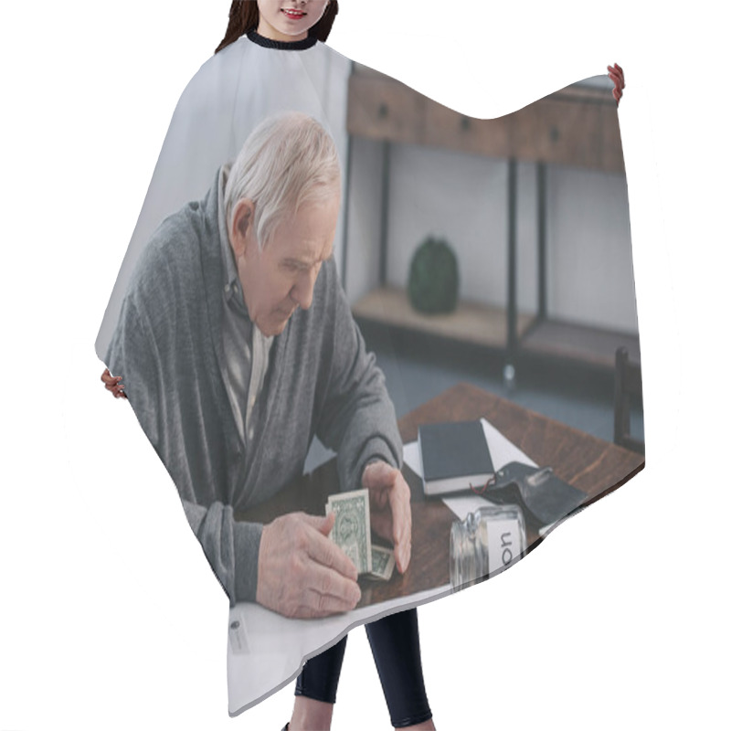 Personality  Senior Man Sitting At Table With Money, Paperwork And Glass Jar With 'pension' Lettering Hair Cutting Cape