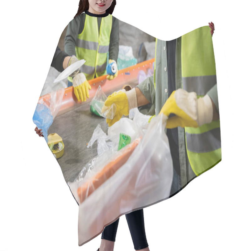 Personality  Cropped View Of Sorter In Gloves And Protective Vest Holding Blurred Plastic Bag And Taking Trash From Conveyor While Working Near Colleagues In Waste Disposal Station, Garbage Recycling Concept Hair Cutting Cape