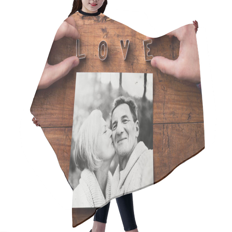 Personality  Hands Creating Love Sign. Picture Of Senior Couple. Studio Shot, Hair Cutting Cape