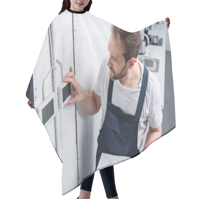 Personality  High Angle View Of Adult Electrician With Clipboard Checking Electrical Panel Hair Cutting Cape