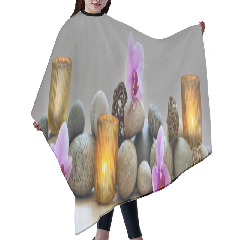 Personality  Concept Of Wellbeing With Pebbles, Orchids And Candles, Panoramic Hair Cutting Cape