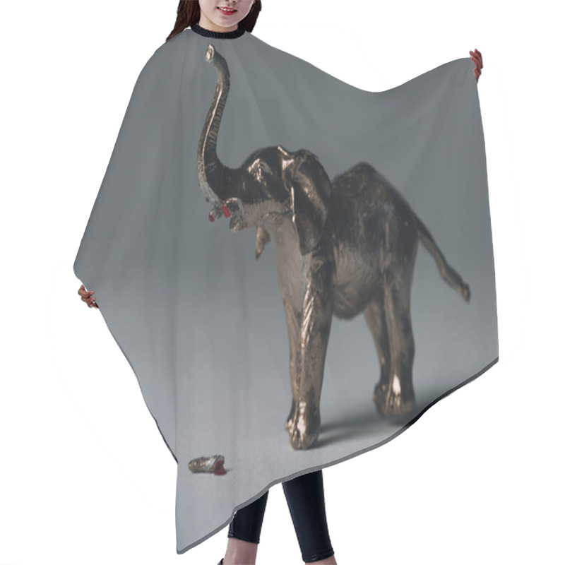 Personality  Golden Toy Elephant With Tusks On Grey Background, Hunting For Tusks Concept Hair Cutting Cape