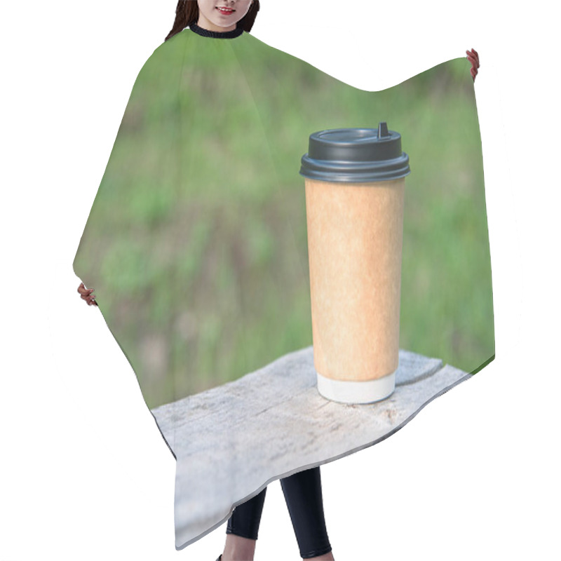 Personality  Close-up Paper Cup Of Coffee On Natural Background On A Wooden Bench. For A Coffee Shop. Hair Cutting Cape