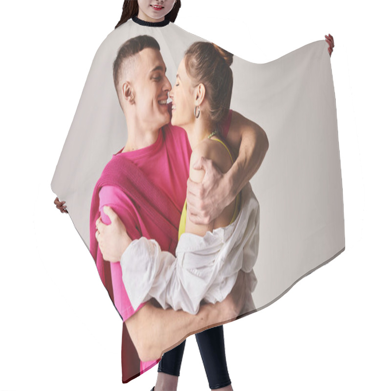 Personality  A Young Man Tenderly Holds His Partner, Wrapped In A Soft Pink Blanket, Showcasing Love And Warmth. Hair Cutting Cape