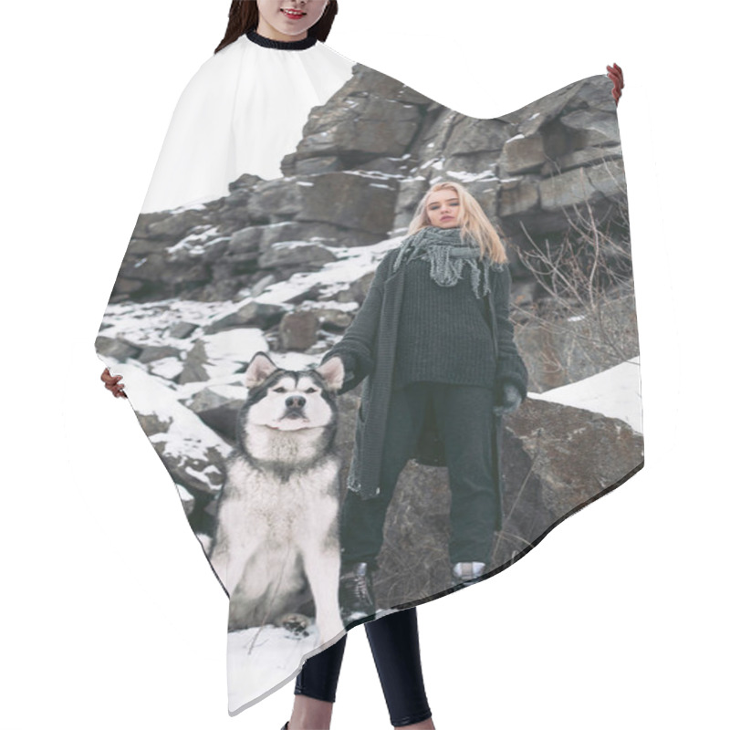 Personality  Girl With Dog Malamute Among Rocks In Winter. Hair Cutting Cape