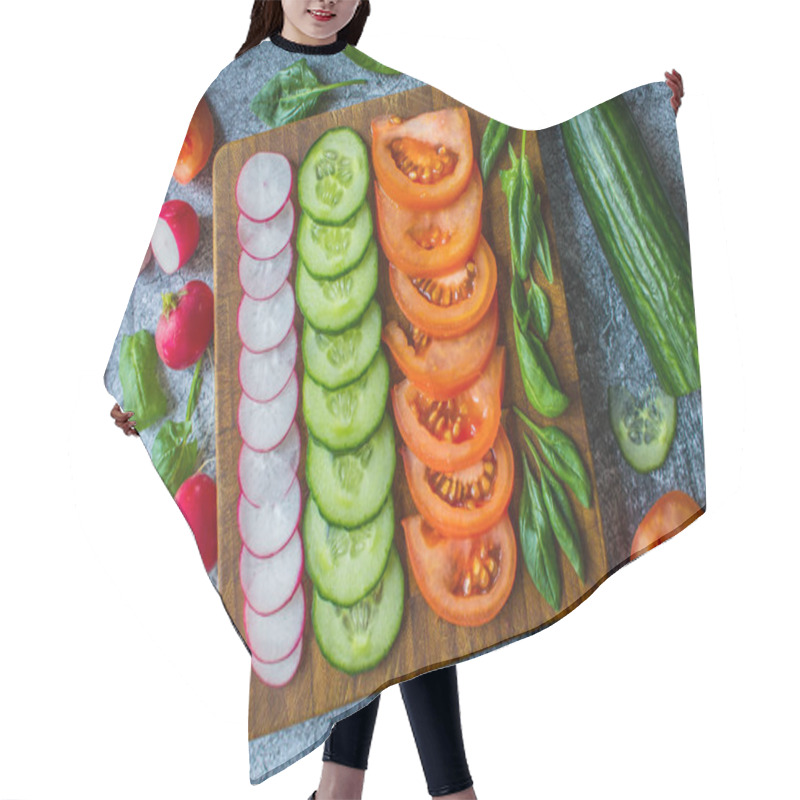 Personality  Slices Of Fresh Cucumbers, Tomatoes And Radishes Arranged In Rows On A Board On A Gray Background. Flat Lay. Hair Cutting Cape