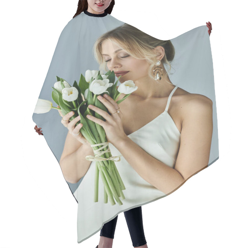 Personality  A Graceful Woman In White Dress Holding A Vibrant Bouquet Of Flowers Against A Grey Background. Hair Cutting Cape