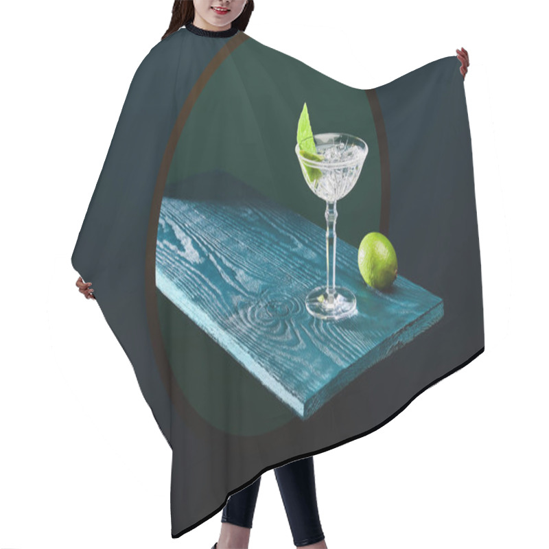 Personality  High Angle View Of Cocktail Glass With Mint Leaf And Whole Lime On Blue Wooden Surface On Geometric Background Hair Cutting Cape