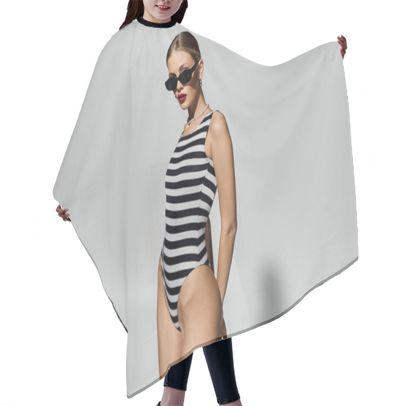 Personality  Stylish Woman Poses In Trendy Black And White Striped One-piece Swimsuit. Hair Cutting Cape