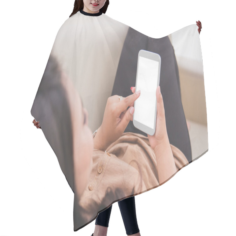 Personality  Woman Laying On A Couch, Holding A Cellphone. Hair Cutting Cape