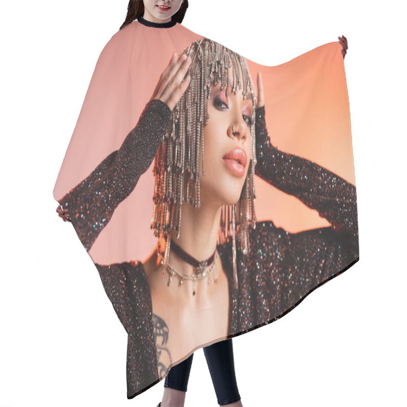 Personality  Portrait Of Tattooed Woman In Black Lurex Dress Touching Wig With Shiny Rhinestones On Coral Pink Background Hair Cutting Cape