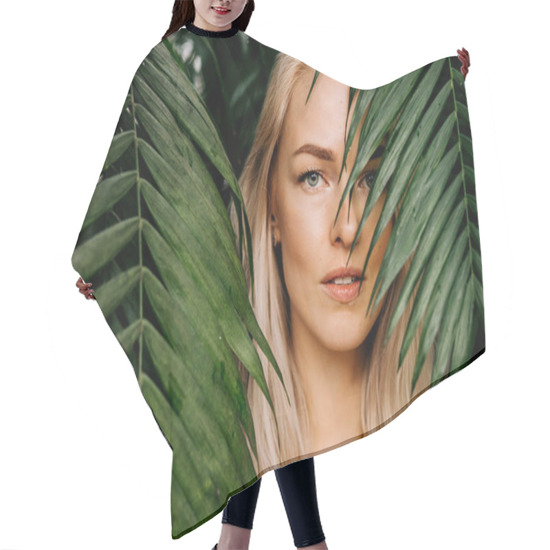 Personality  Young Woman's Face Surrounded By Tropical Leaves. Closeup Portrait Of Magnificent Lady With Natural Nude Makeup, Perfect Skin, Blonde Hair. Natural Cosmetic, Wellness, Purity, Skincare, Beauty Concept Hair Cutting Cape