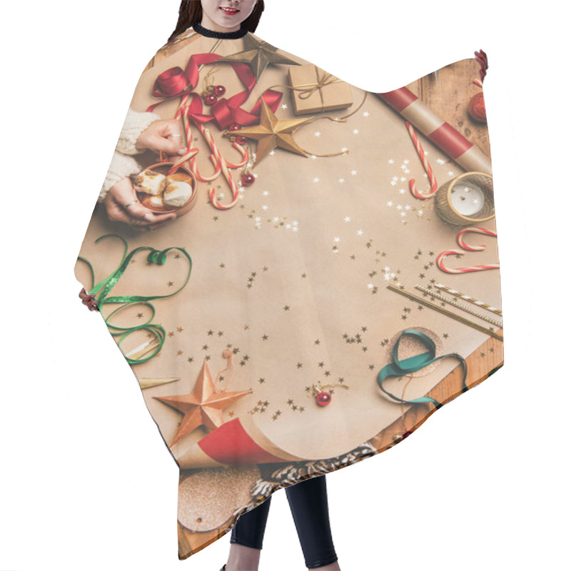 Personality  Preparing For New Year. Flat-lay Of Hot Chocolate In Mug In Womans Hands, Candy Canes, Decorations, Christmas Ribbons, Wreath, Glittering Balls Over Gift Paper Background, Top View, Copy Space Hair Cutting Cape