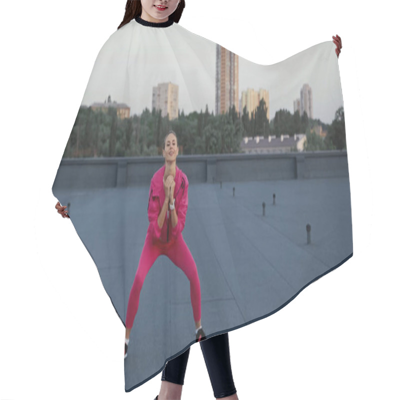 Personality  Smiling Sportswoman Training And Looking At Camera On Roof  Hair Cutting Cape