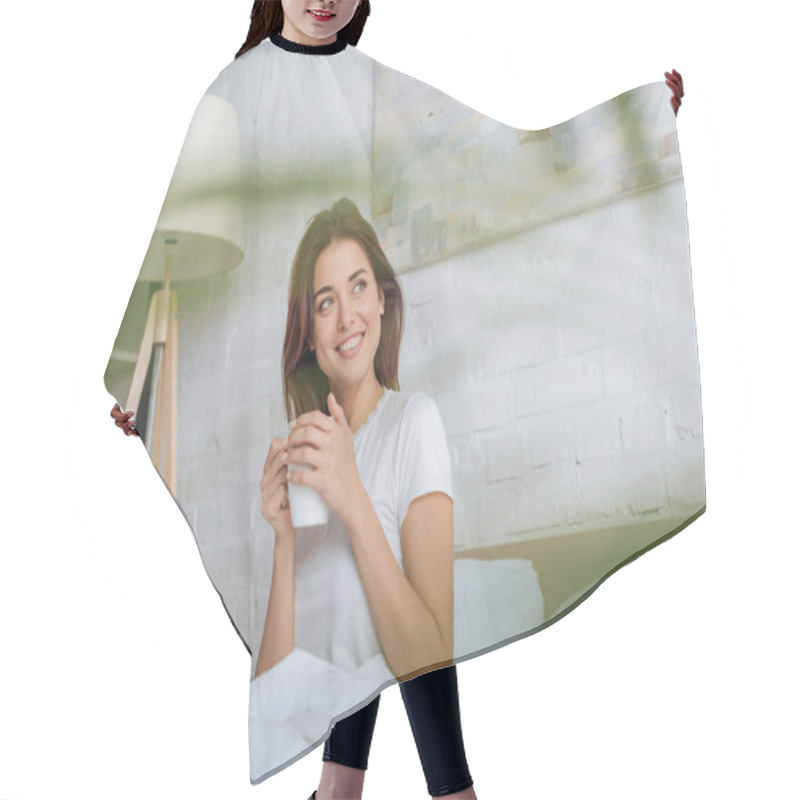 Personality  Selective Focus Of Happy Young Woman Looking Away While Holding Cup With Tea In Bed  Hair Cutting Cape